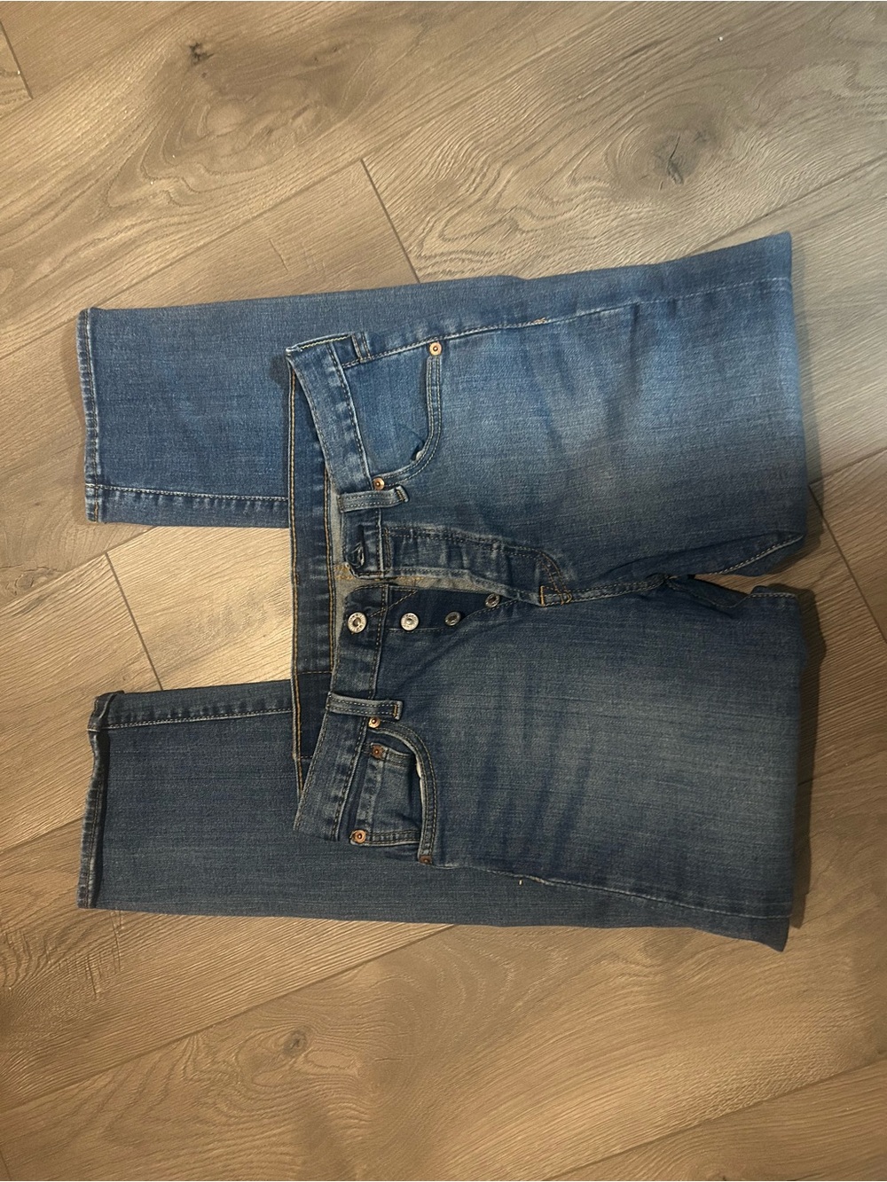 Levi's dark blue denim jeans with tan leather patch